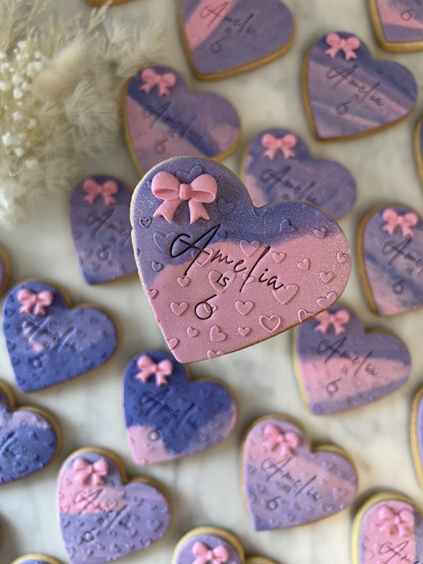 Heart with debossed heart detailing, 3D bow embelishment and personalisation